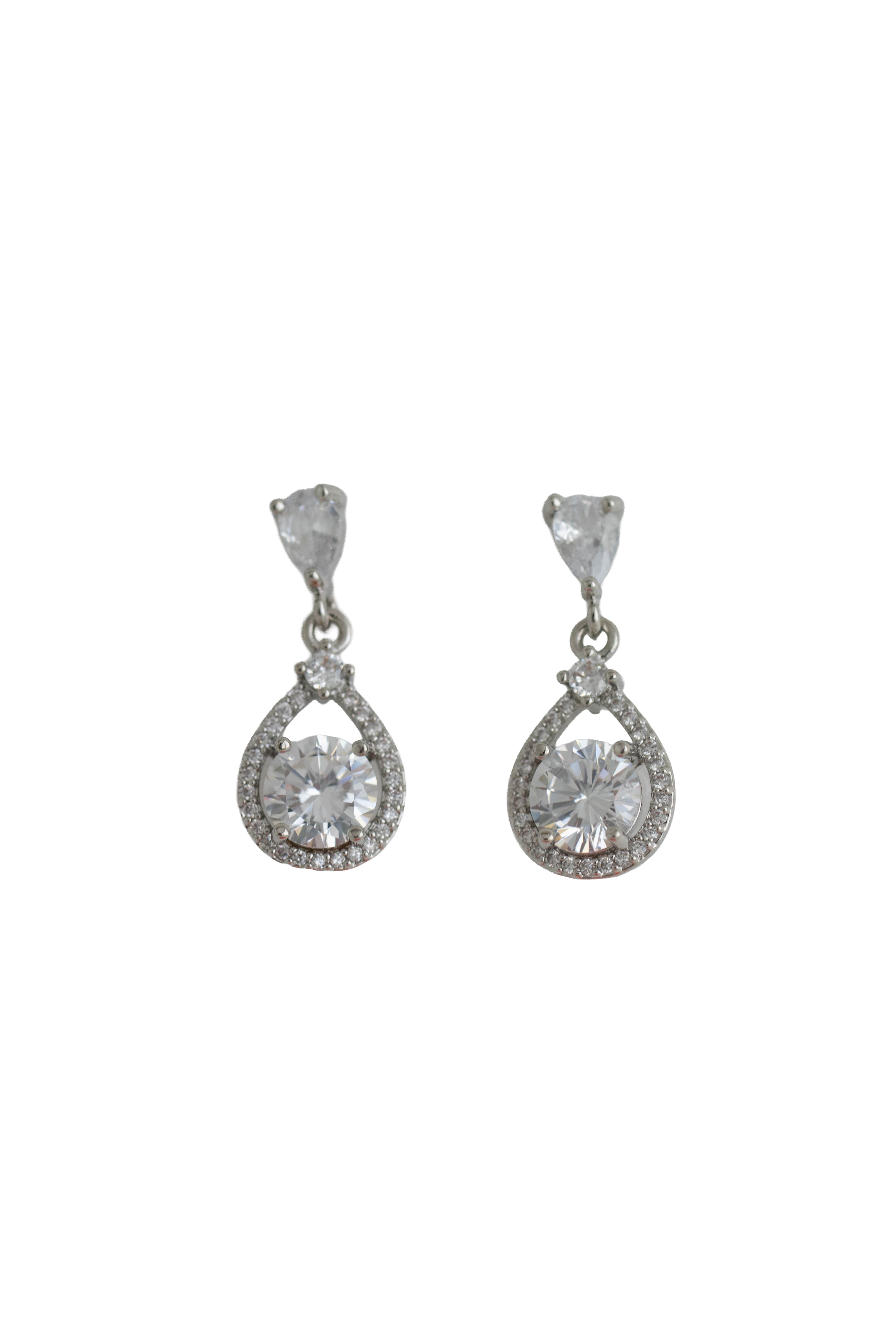 silver drop earrings featuring a round crystal set within an open pave teardrop frame
